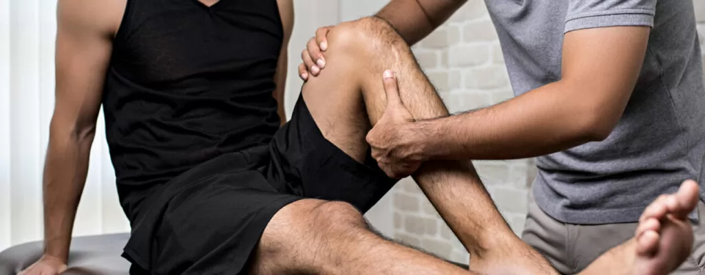 A man doing leg stretching exercise